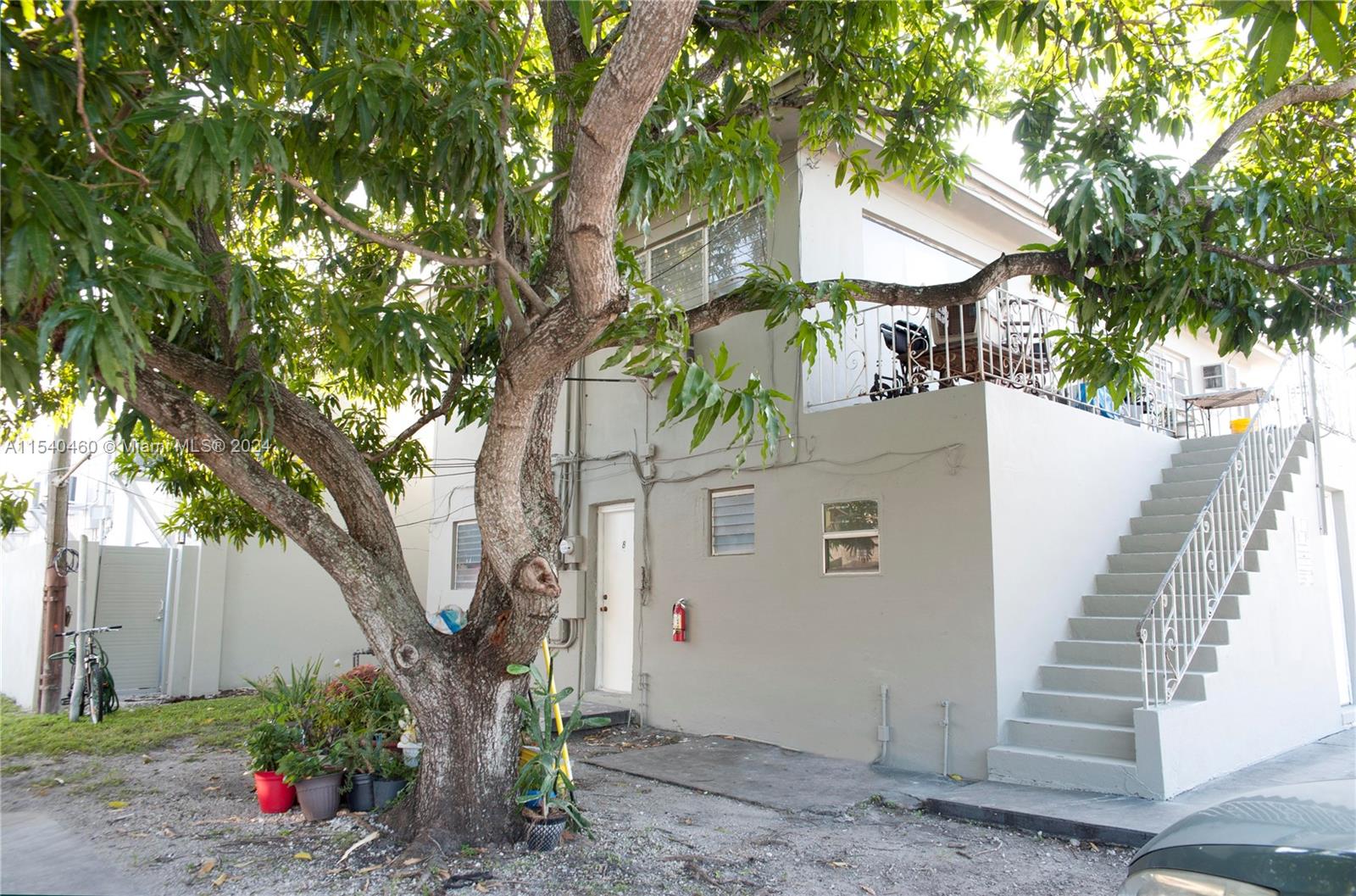 a view of a house with a tree