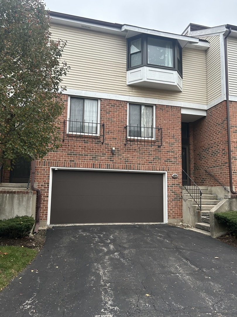 a view of a house with a parking space