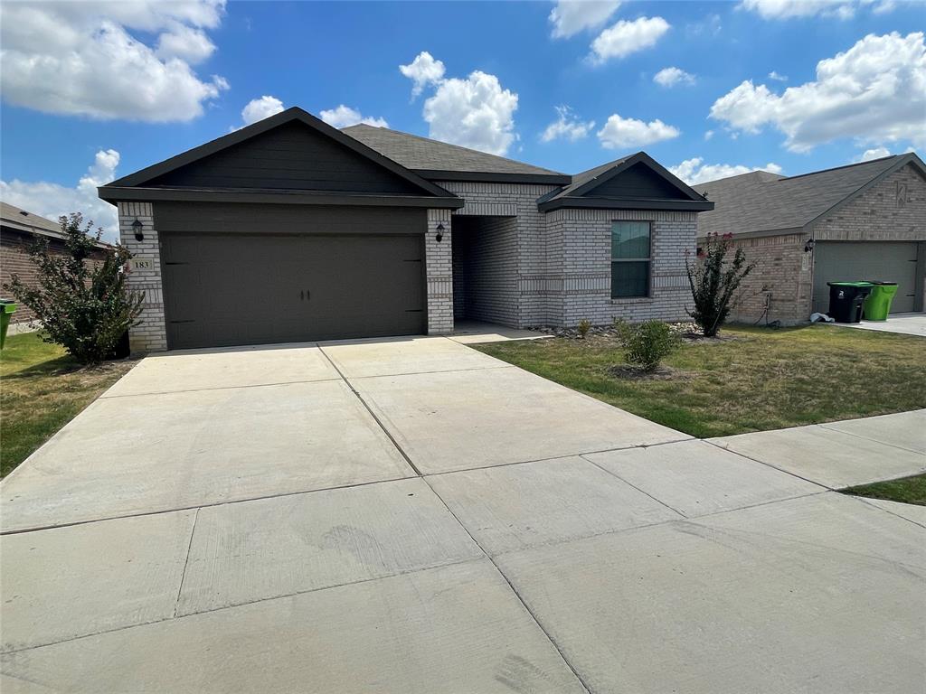 a front view of a house with yard