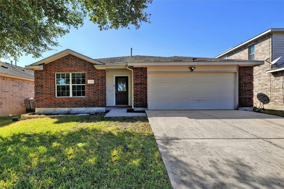 a front view of a house with yard