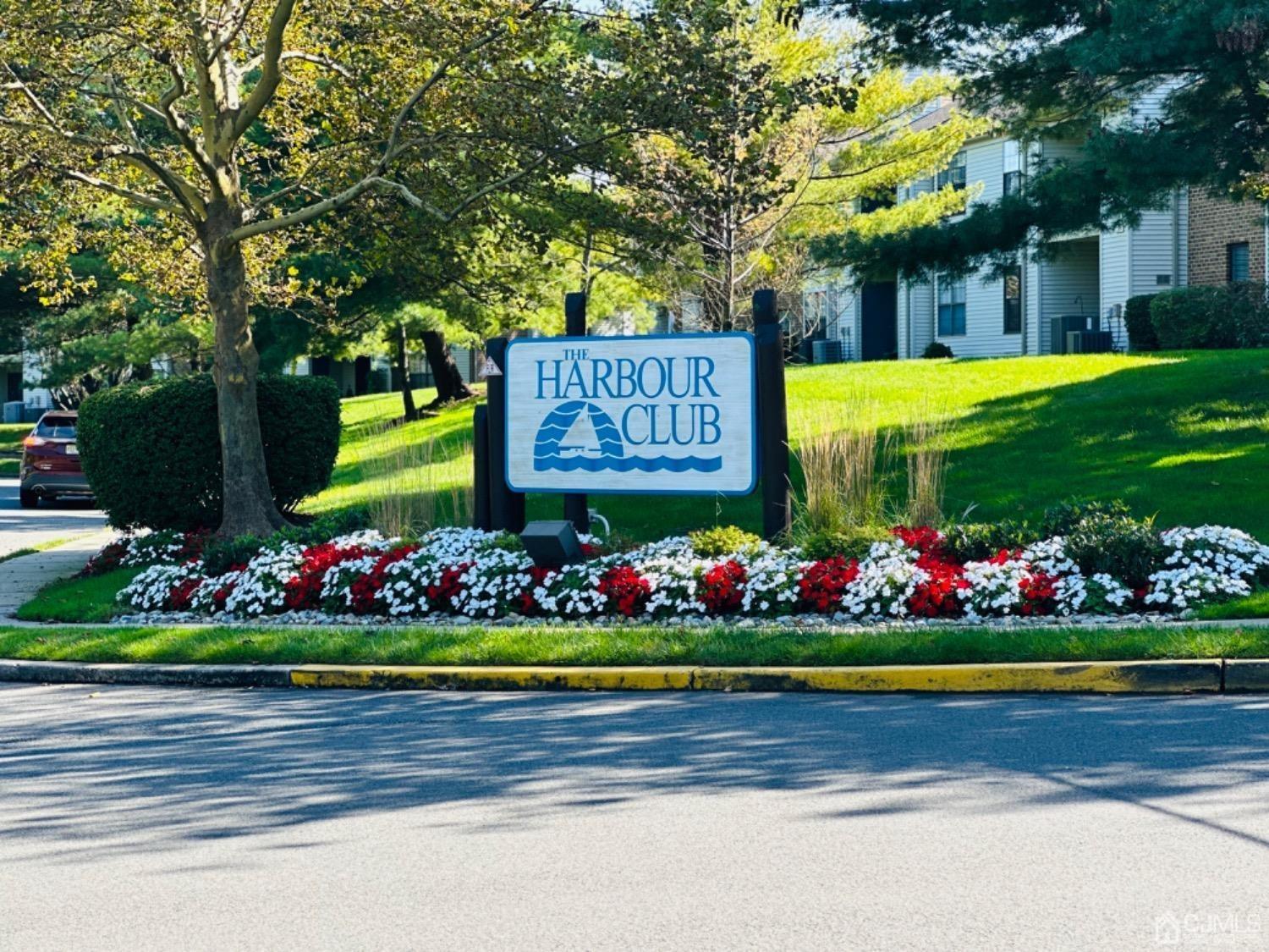 a sign that is in front of flowers