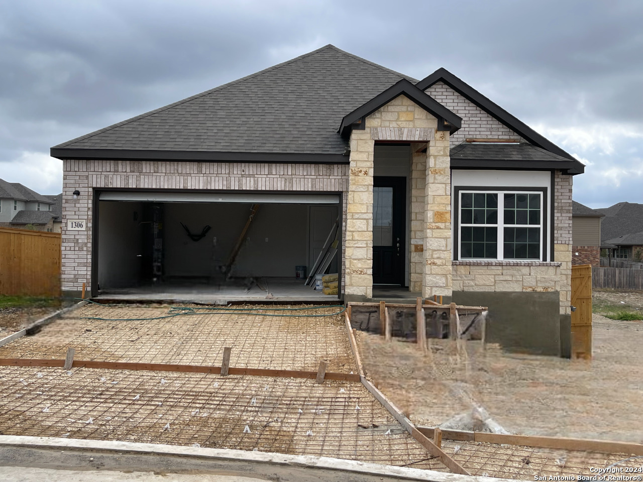 a front view of a house with garage