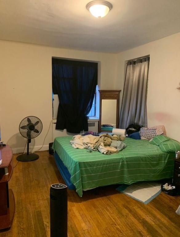 Bedroom featuring wood-type flooring