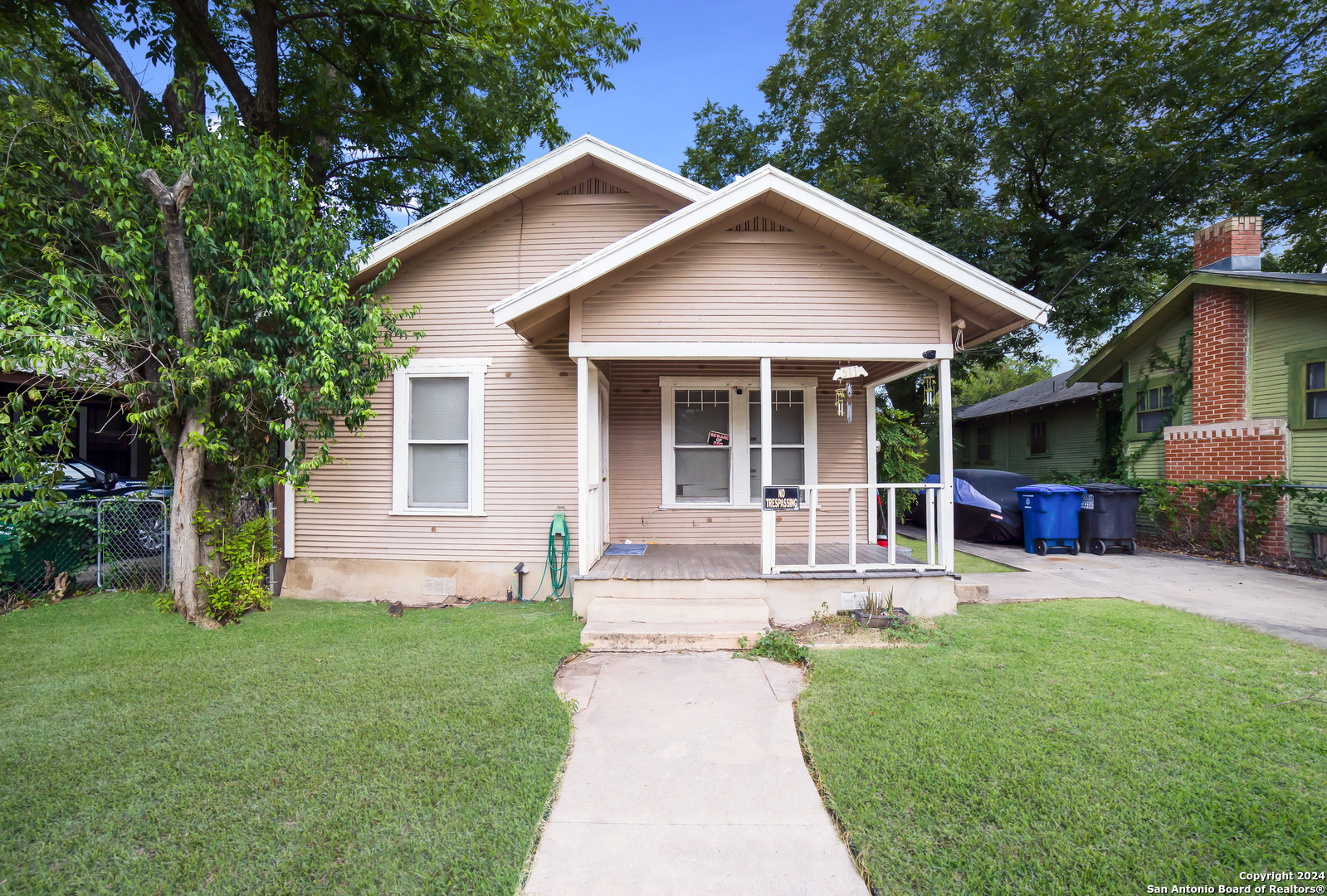 a front view of a house with a yard and porch