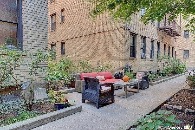 a backyard of a house with yard and outdoor seating