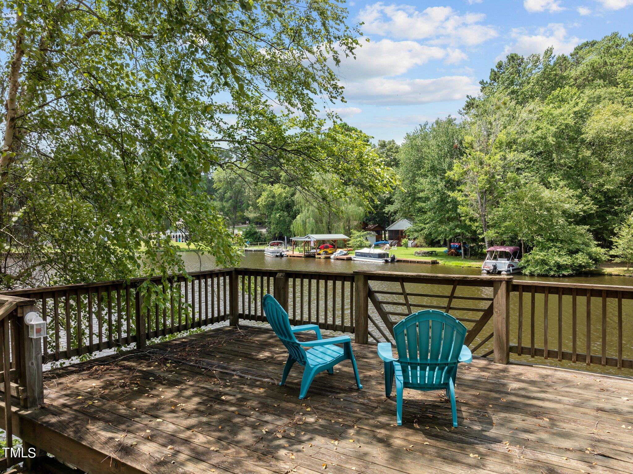 a view of a chair and table on the deck