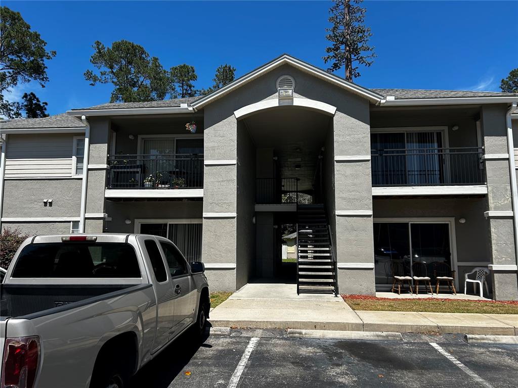 a front view of a house with parking