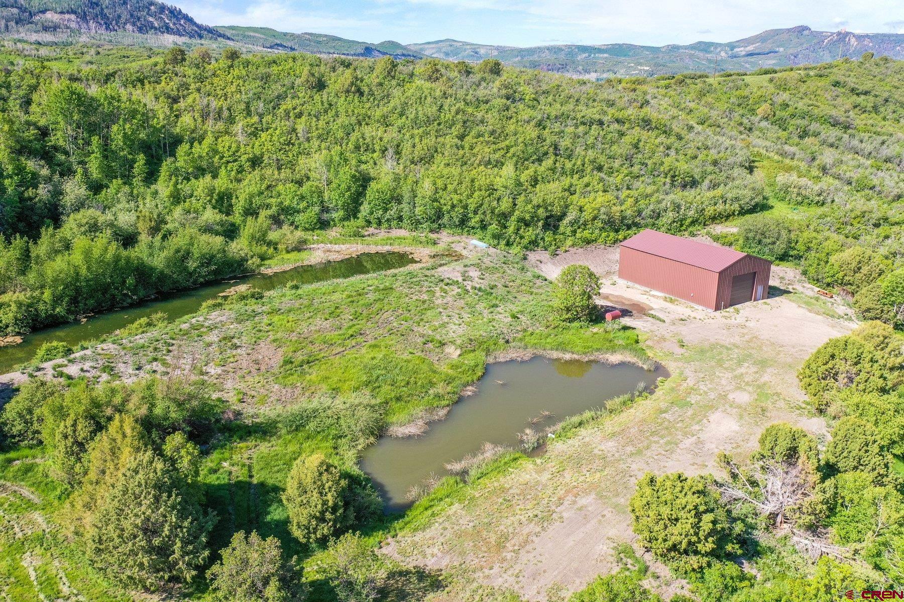 a view of a lake with a yard