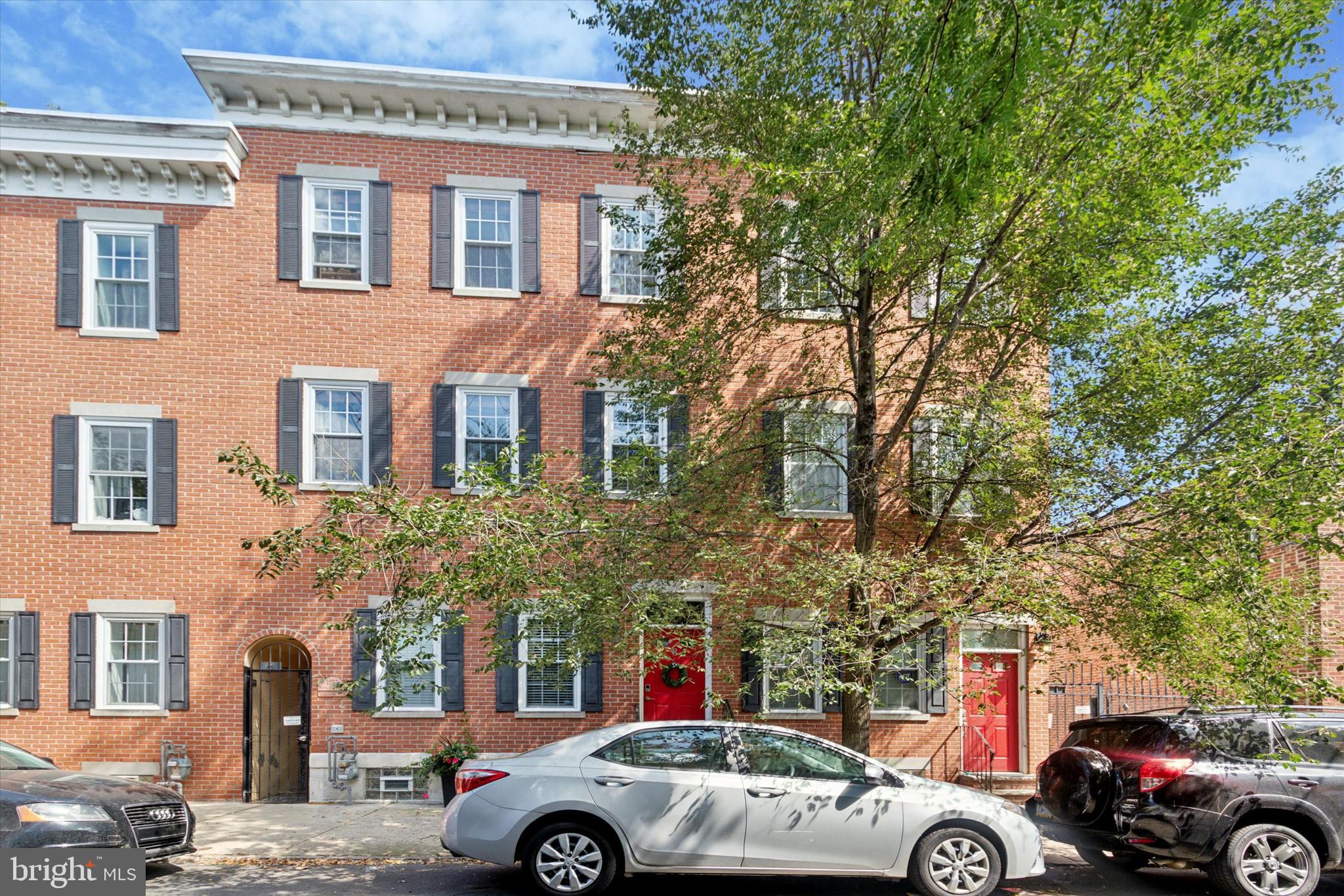 a front view of a building with parking space