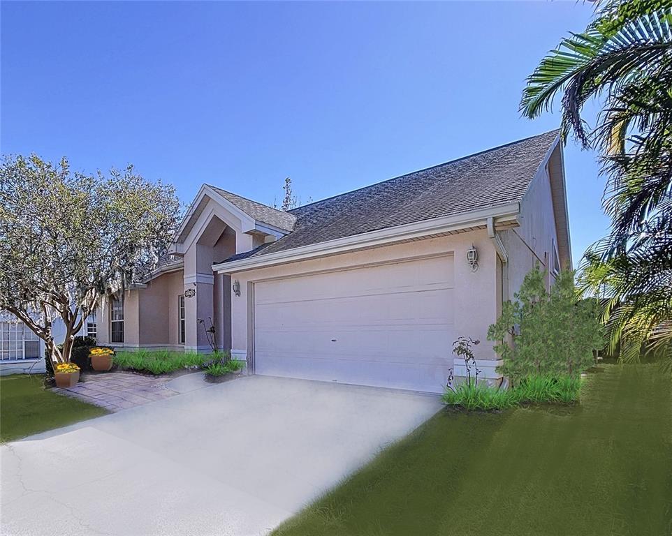 a front view of house with yard and trees