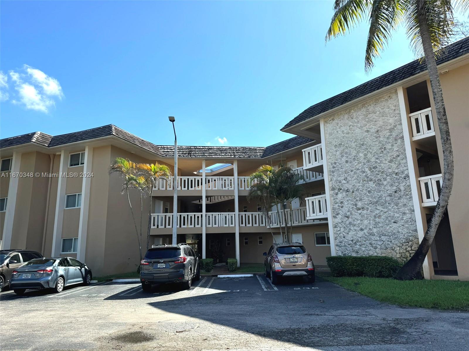 a front view of a house with parking space