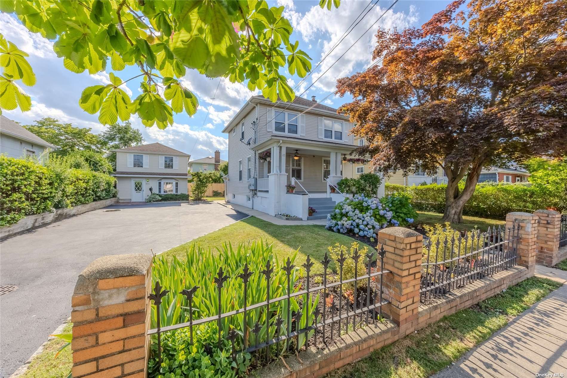 a front view of a house with garden