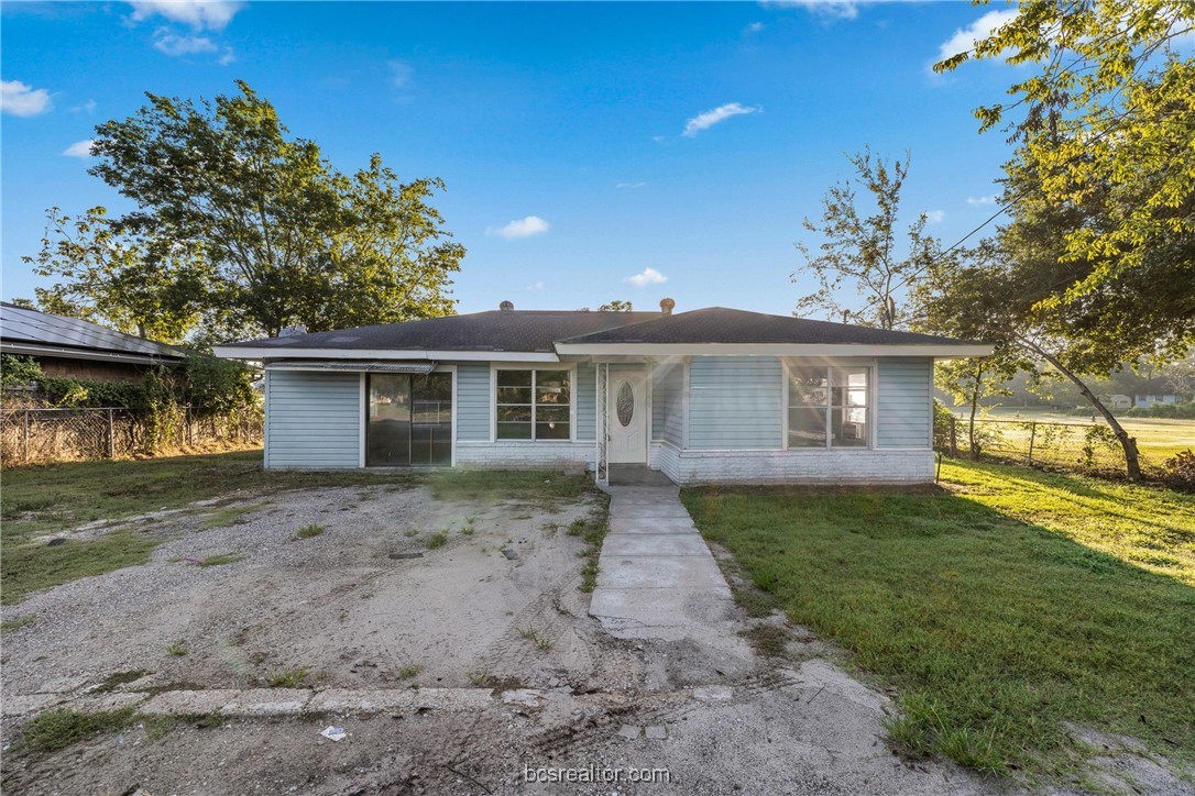 front view of a house with a yard