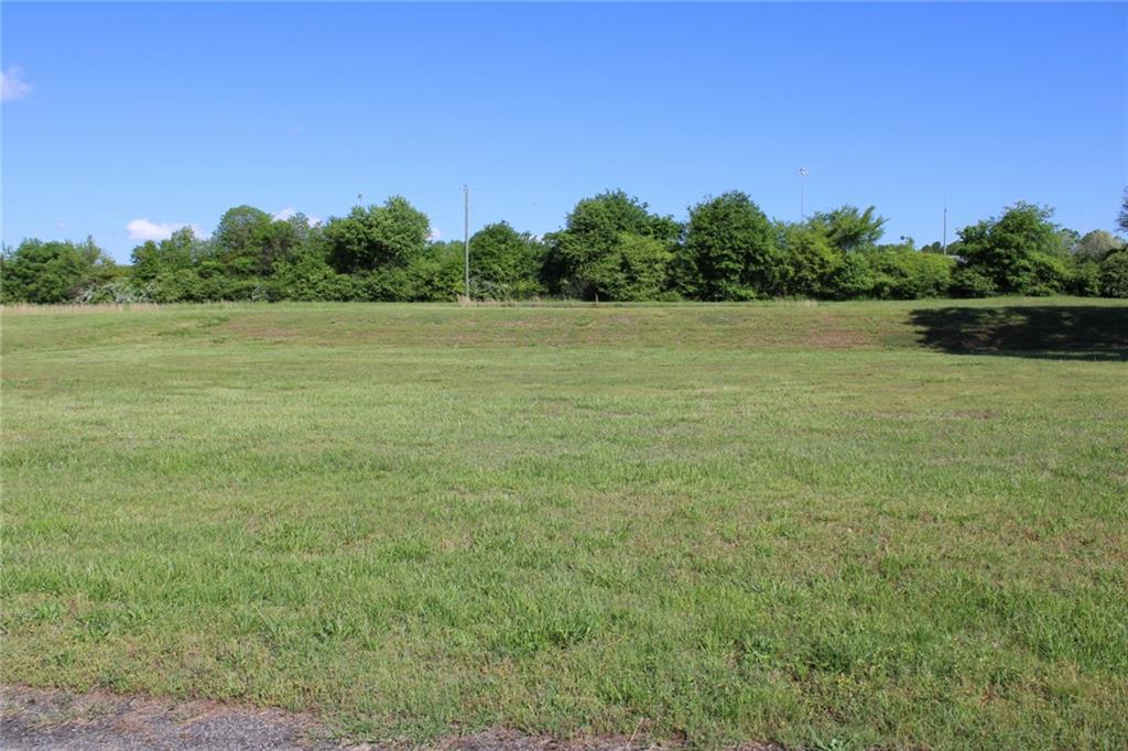 a view of a field with an outdoor space