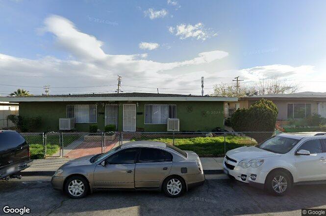 a car parked in front of a house