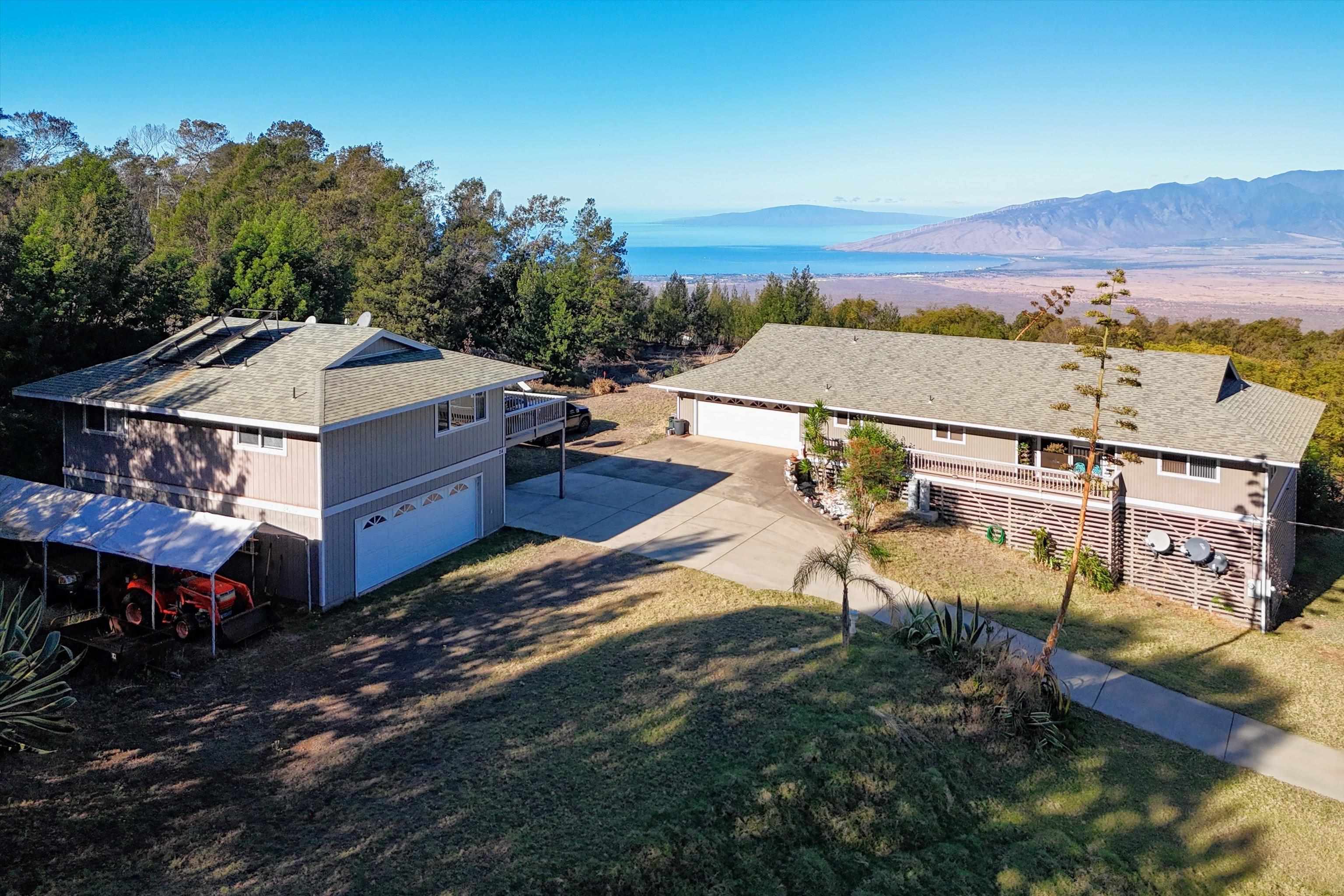 a view of a house with a mountain in the background