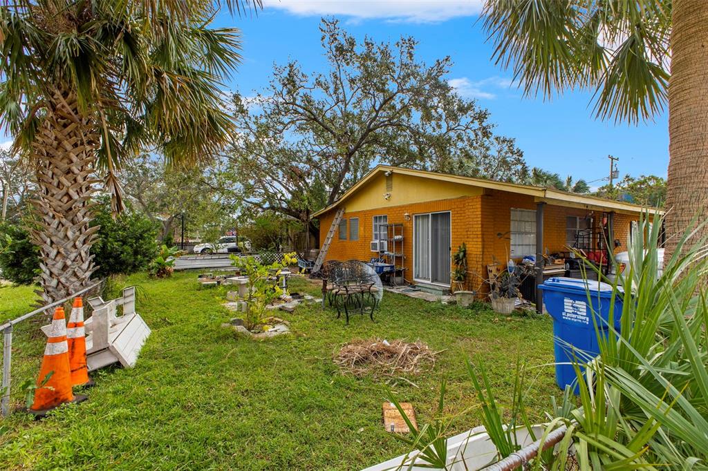 a view of a house with a yard porch and sitting area