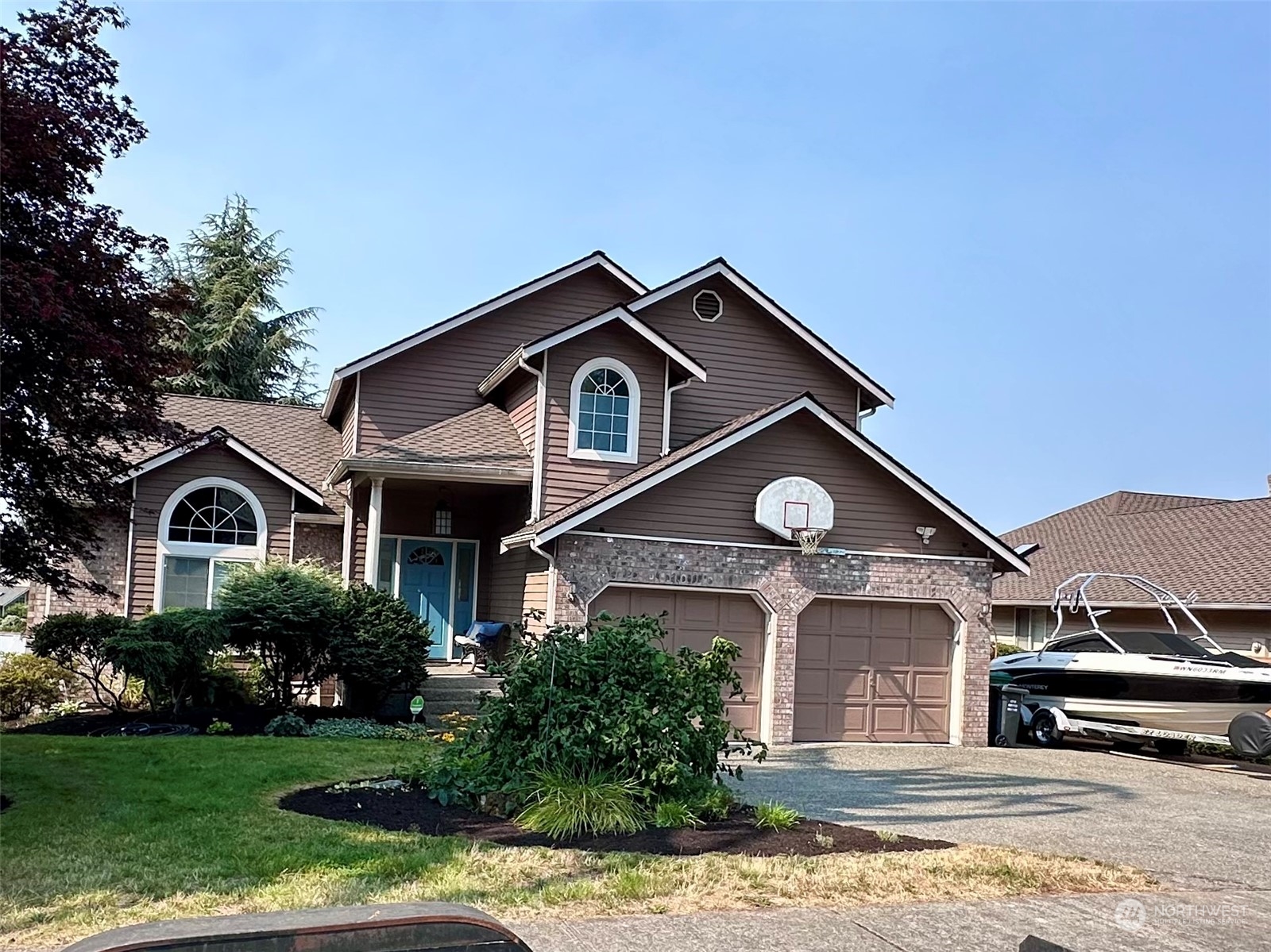 a front view of a house with a yard