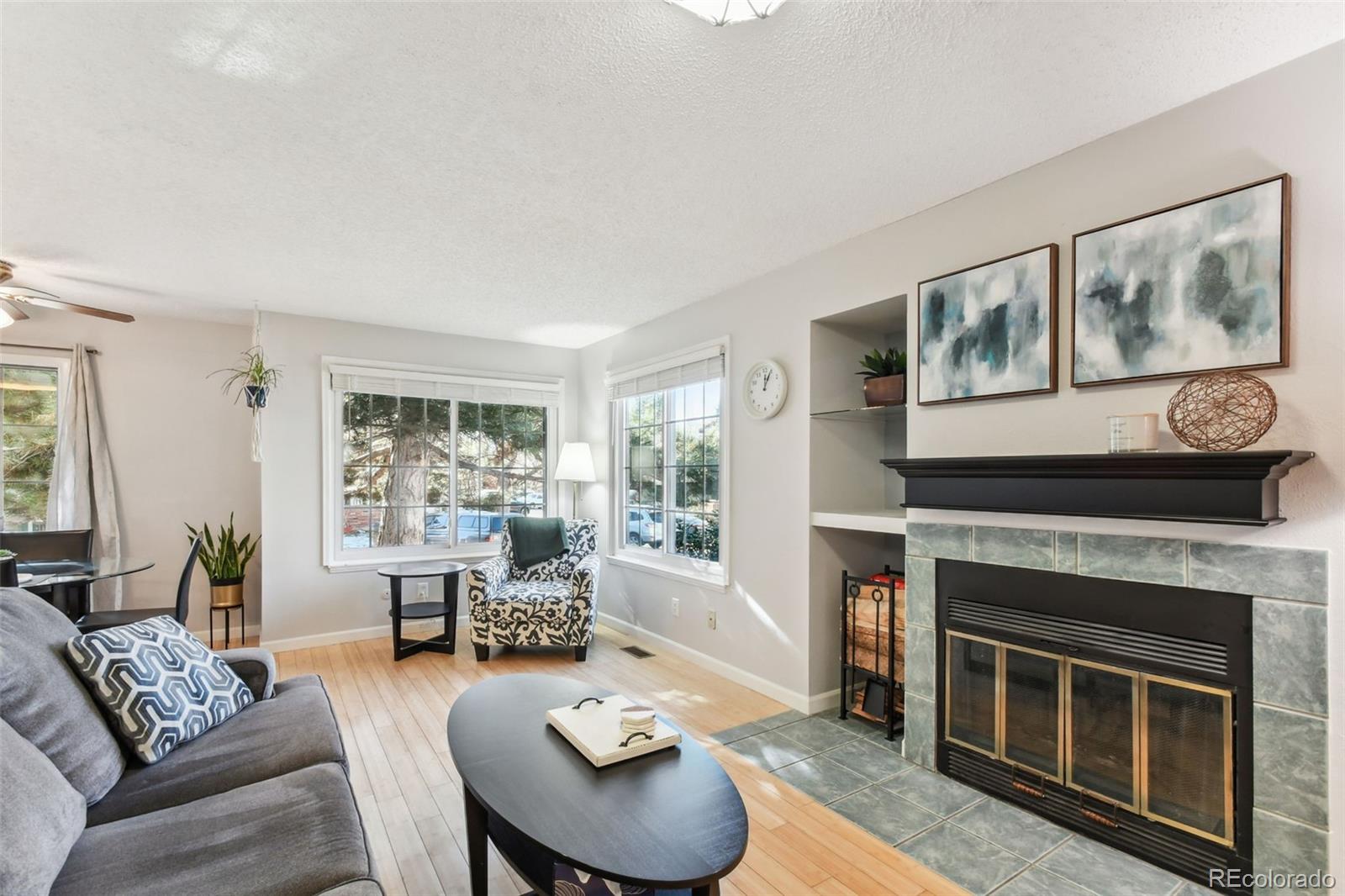 a living room with furniture and a fireplace