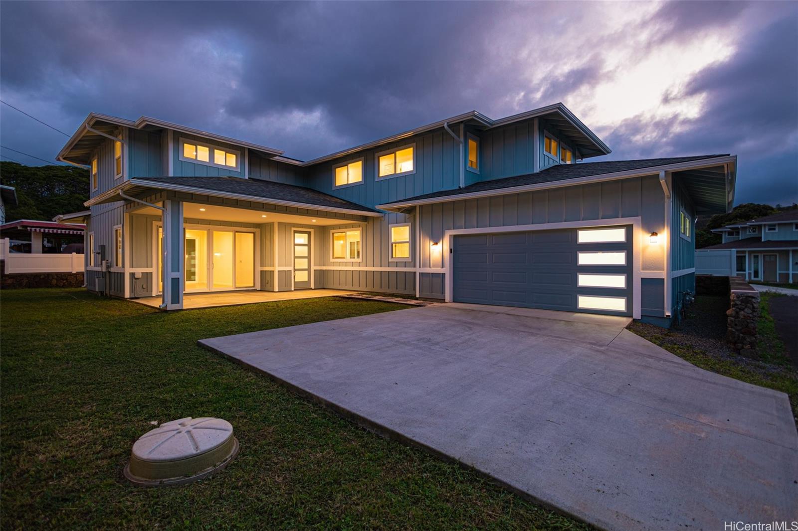 a house with swimming pool in front of it