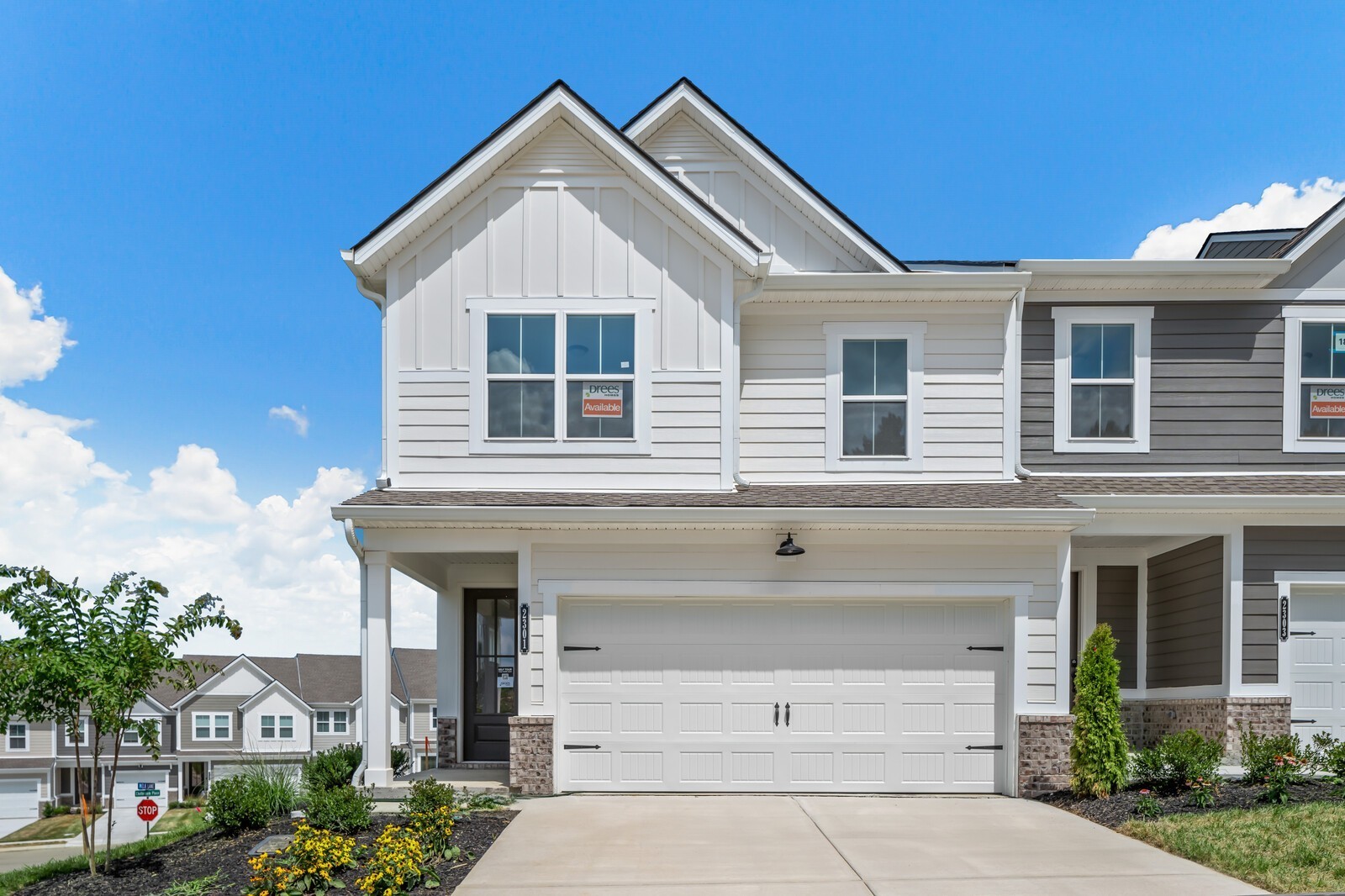 a front view of a house with a yard