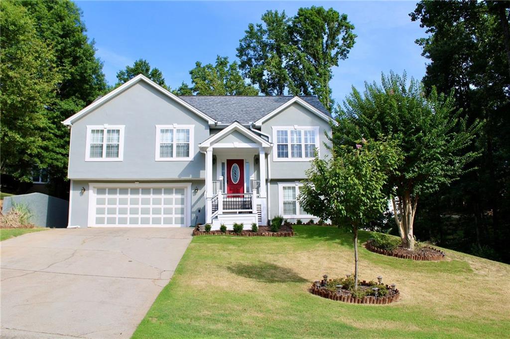 a front view of a house with a yard