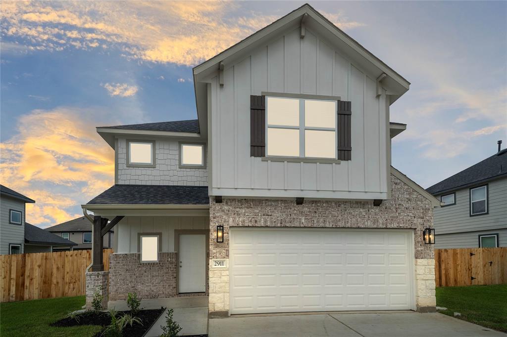 a front view of a house with a garage