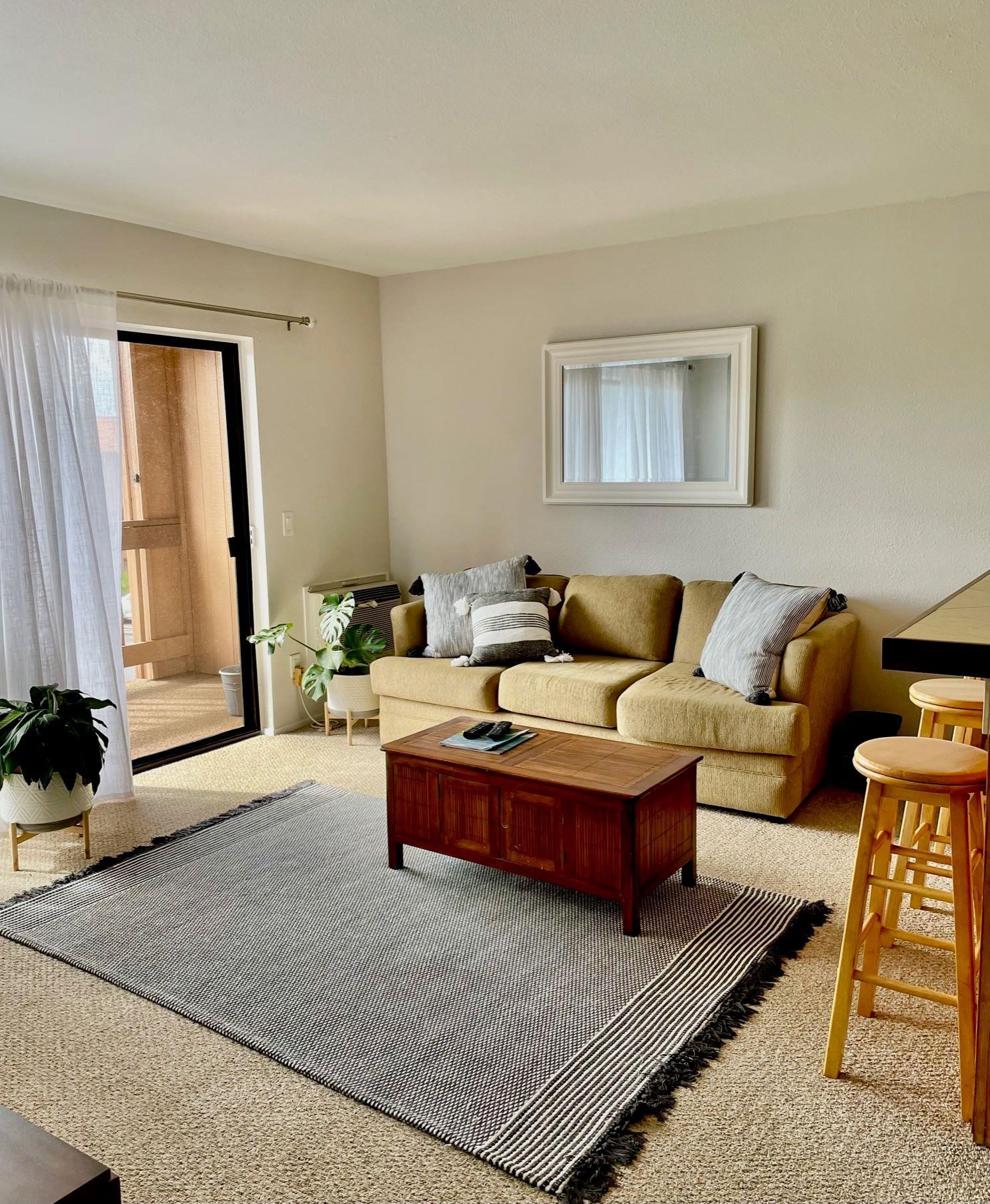 a living room with furniture and a couch