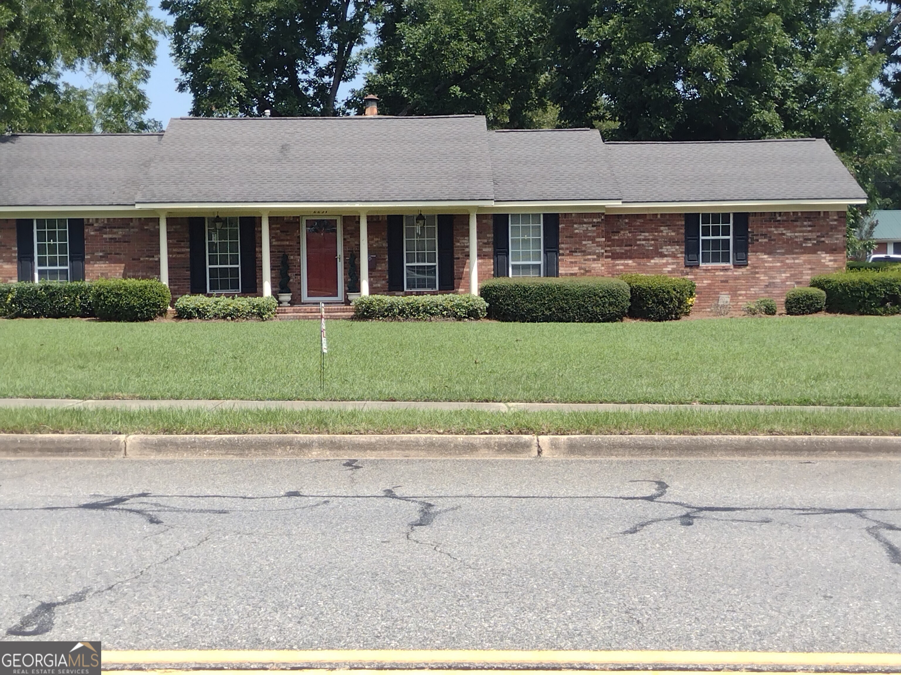 front view of a house and a yard