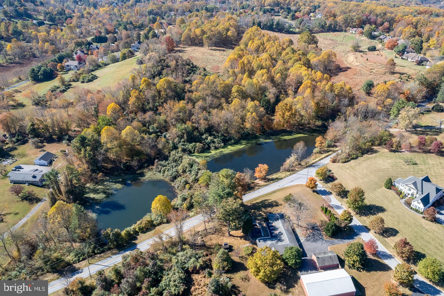 an aerial view of a houses with yard