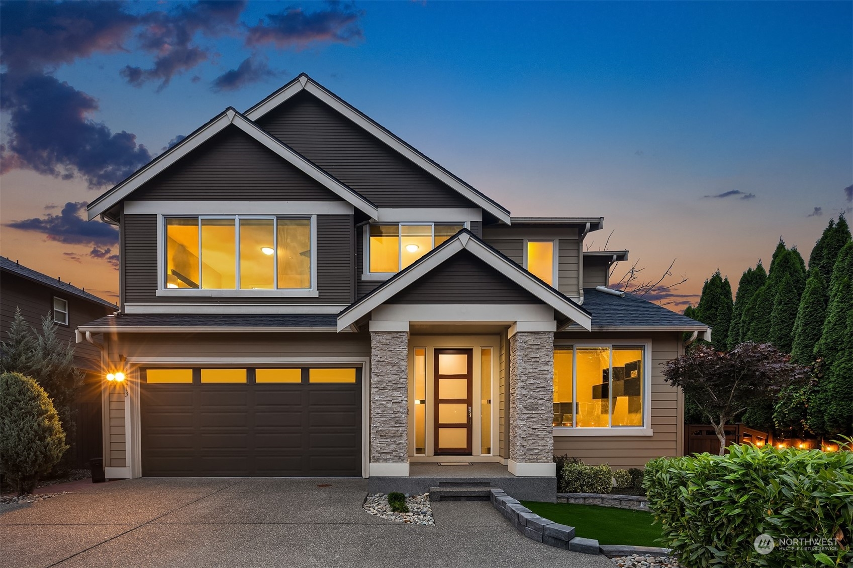 a front view of a house with a garage