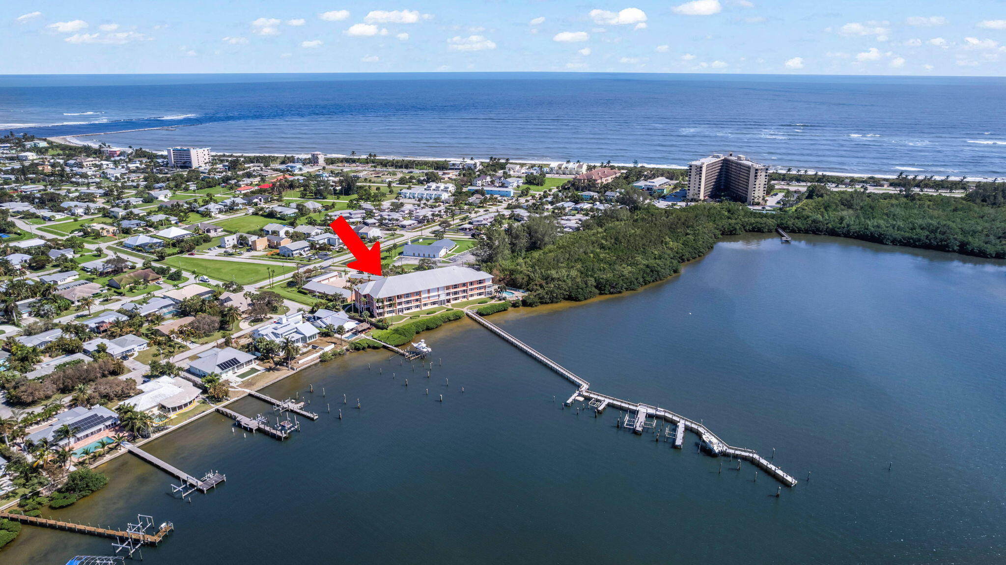 an aerial view of a large parking space and water view