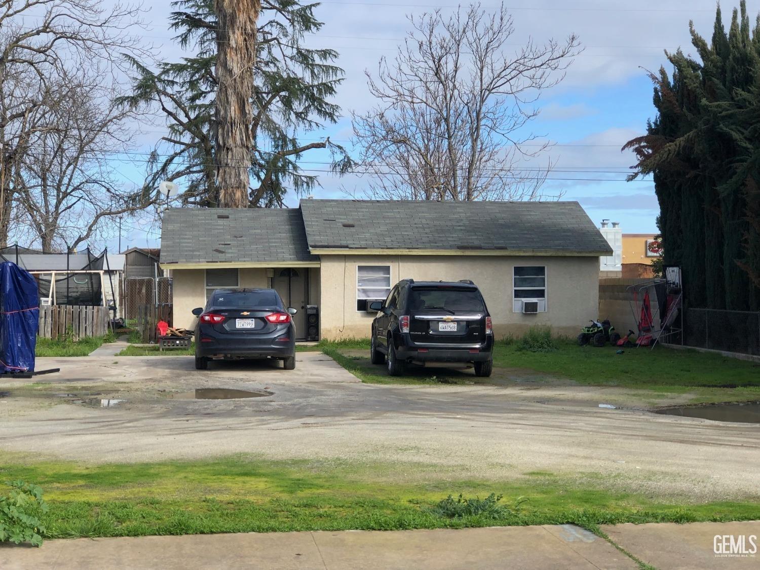 a view of a car parked in front of a house