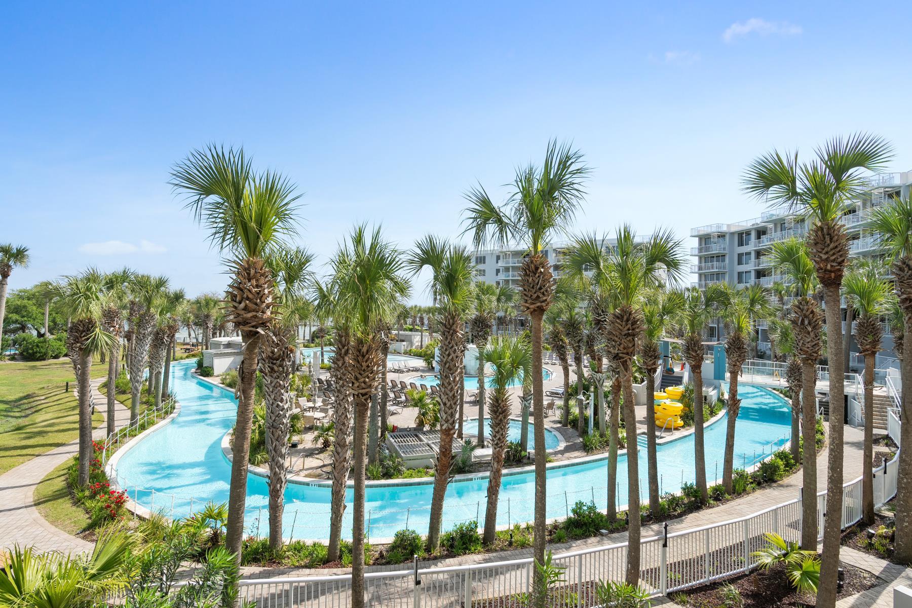 a view of a palm trees in front of a building