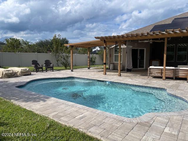 a view of a house with backyard porch and sitting area