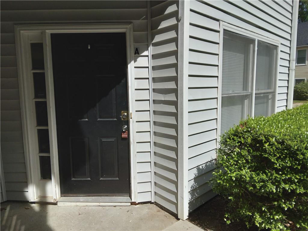 a view of potted plants in front of gate