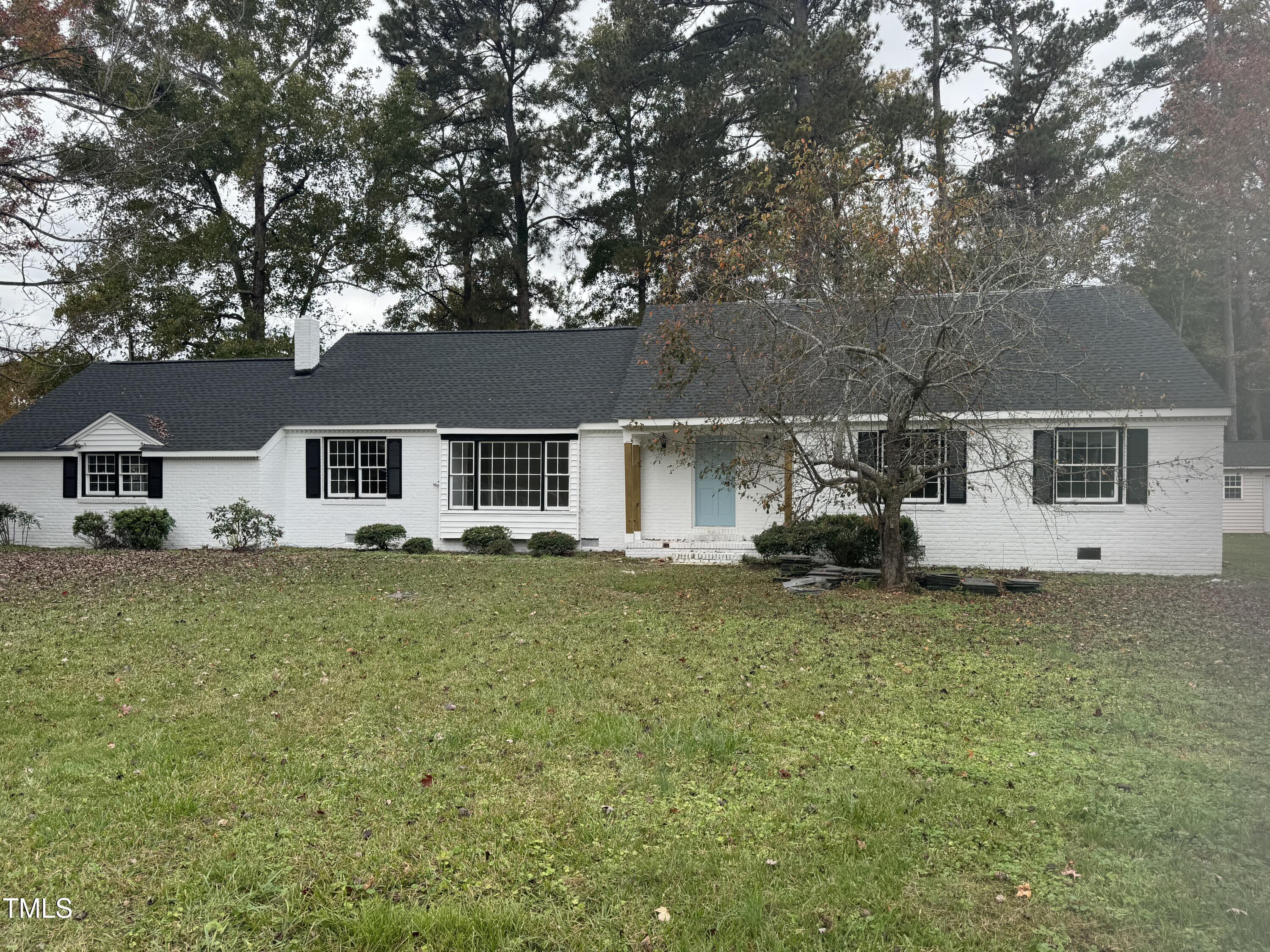 front view of a house with a big yard