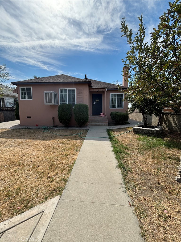 a front view of a house with yard