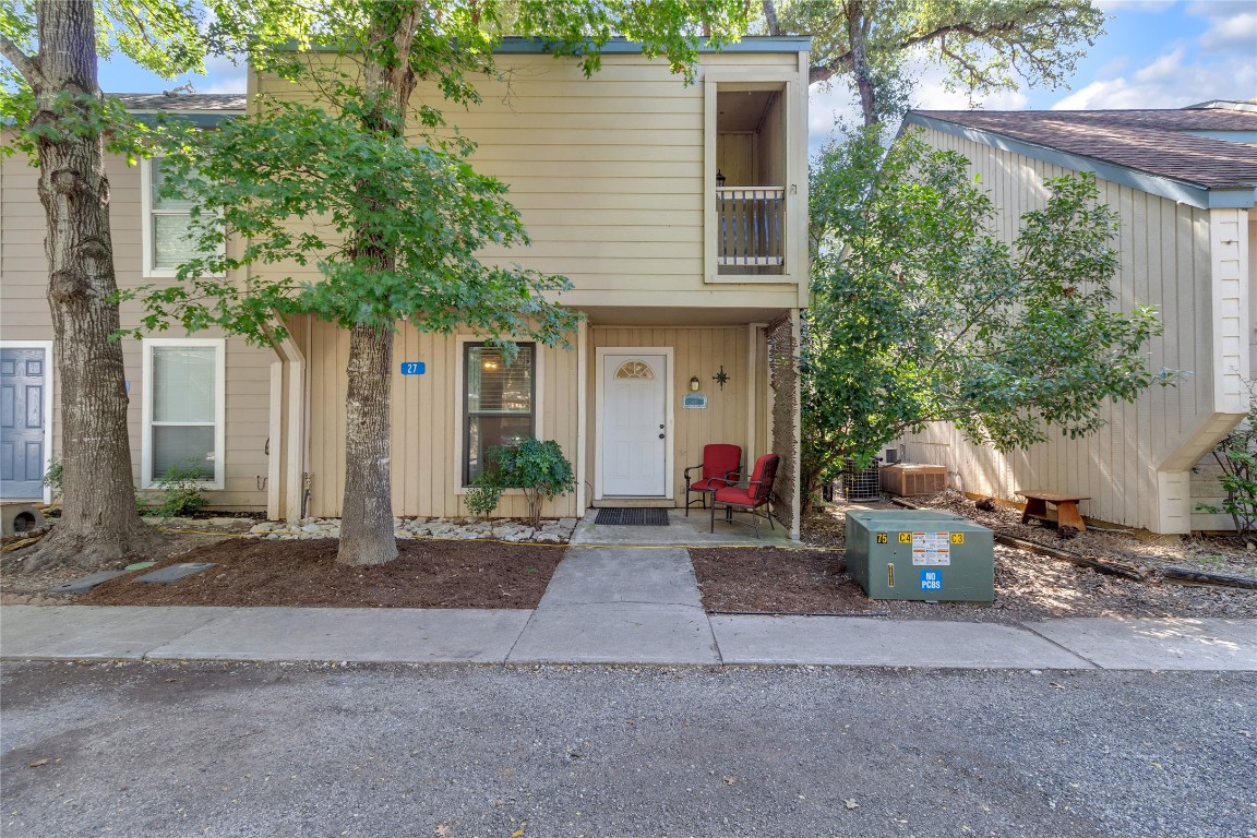 a front view of a house with garden