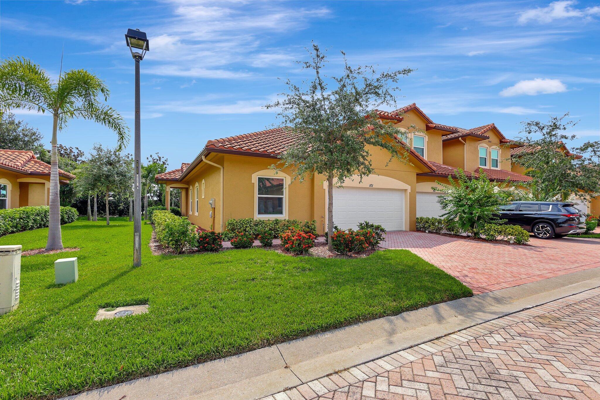 a front view of a house with a yard