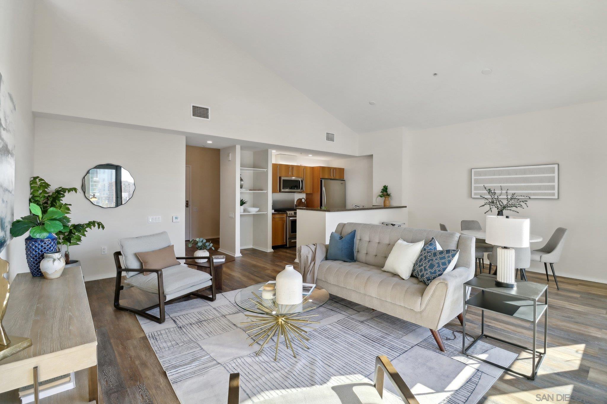 a living room with furniture or couch and a potted plant