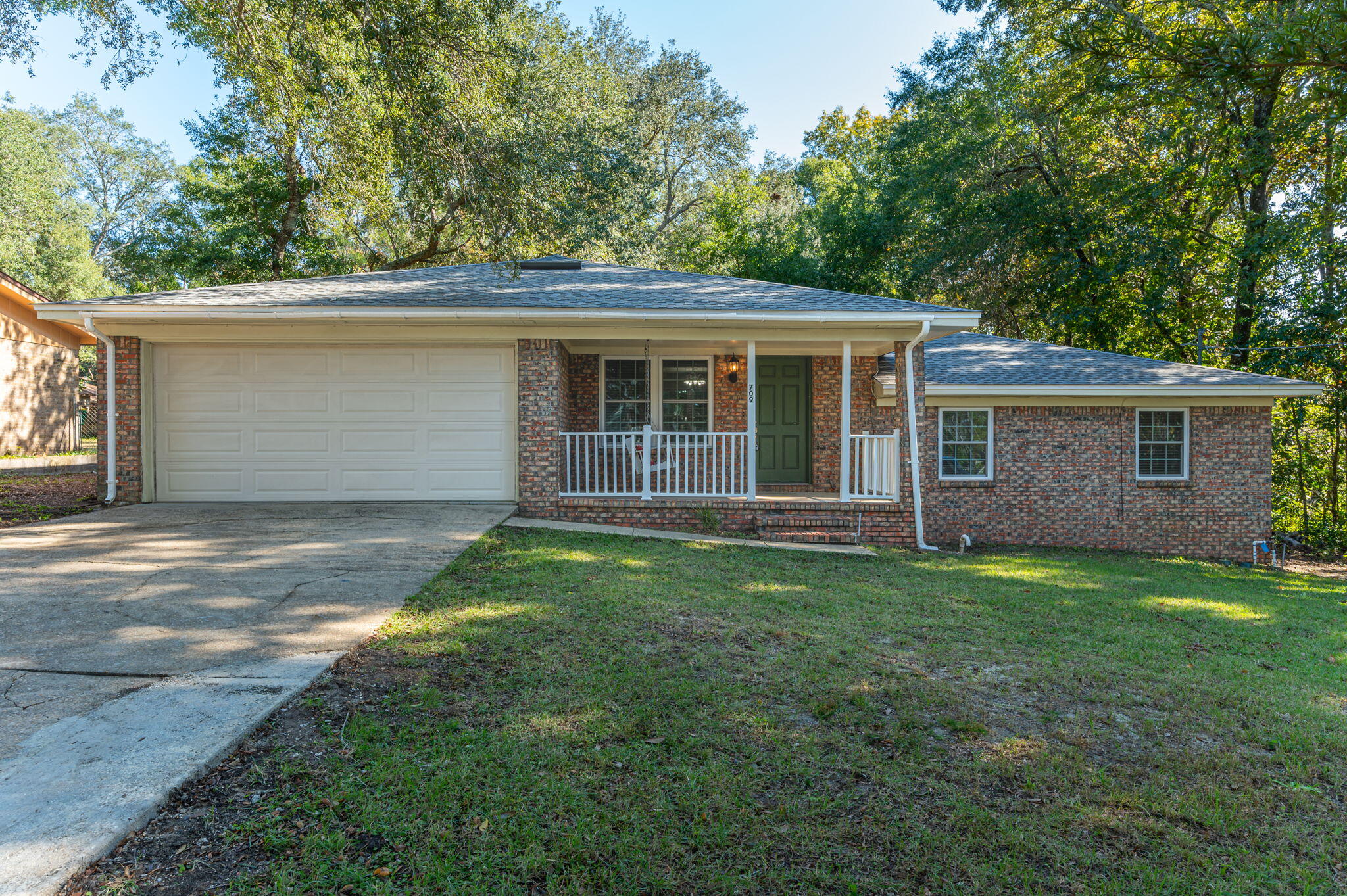 front view of a house with a yard