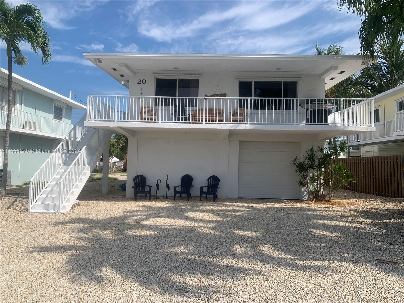 a front view of a house with garage