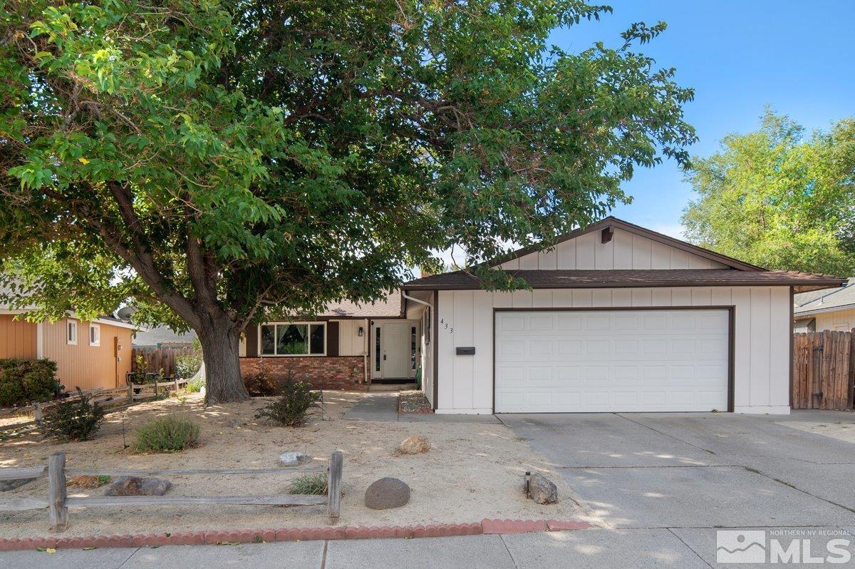 a front view of a house with garage