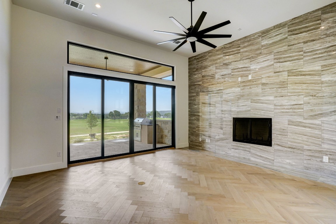 a view of an empty room with glass door