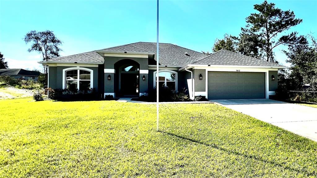 a view of a house with a yard