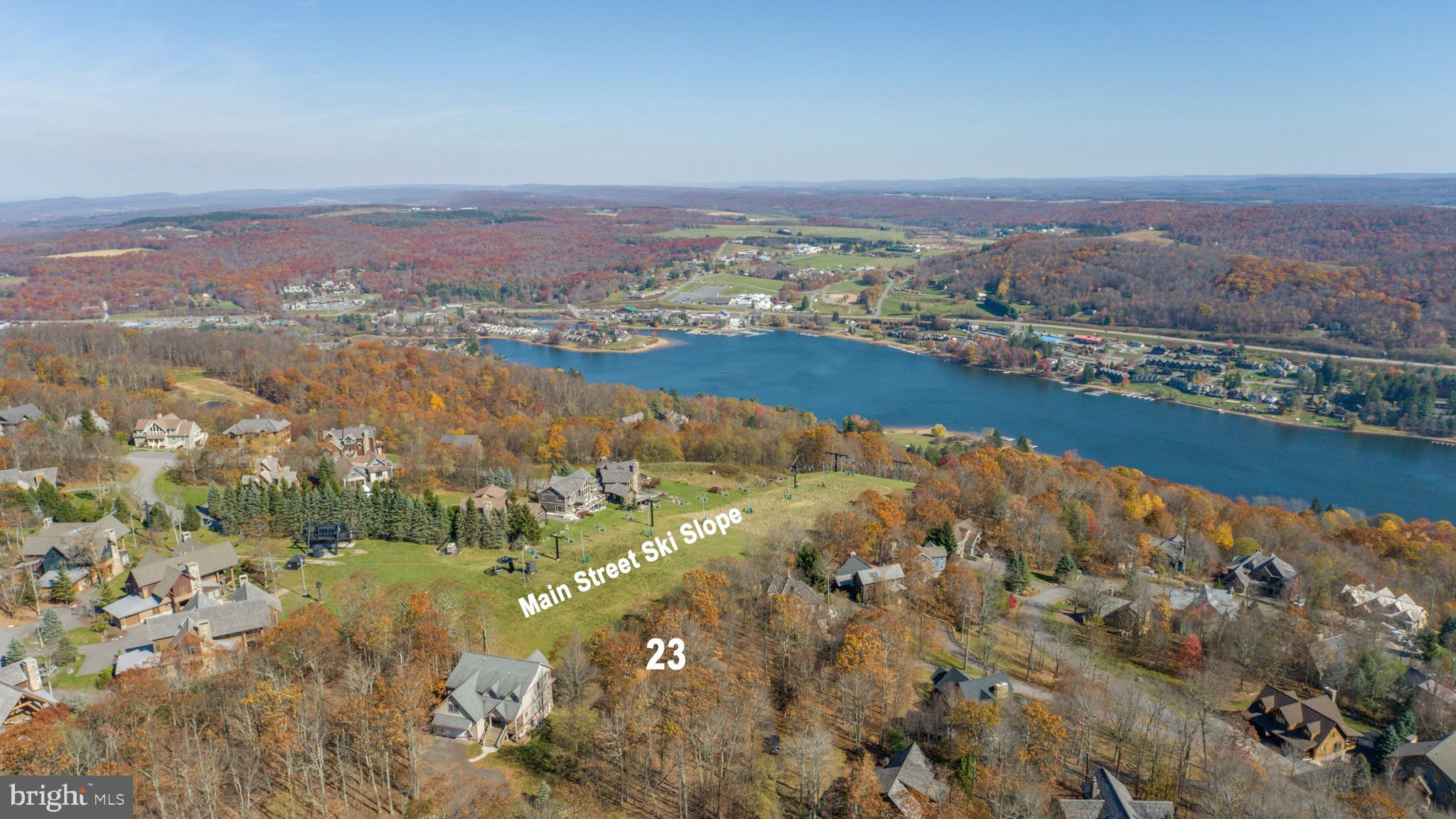 an aerial view of residential building and lake