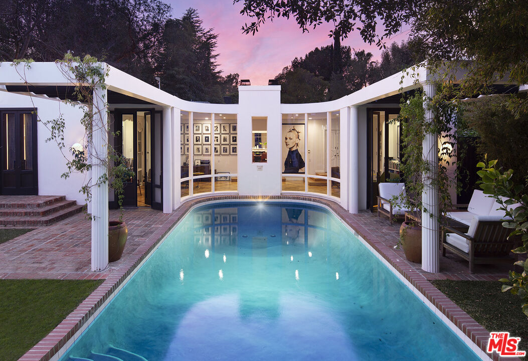 a view of a house with a swimming pool