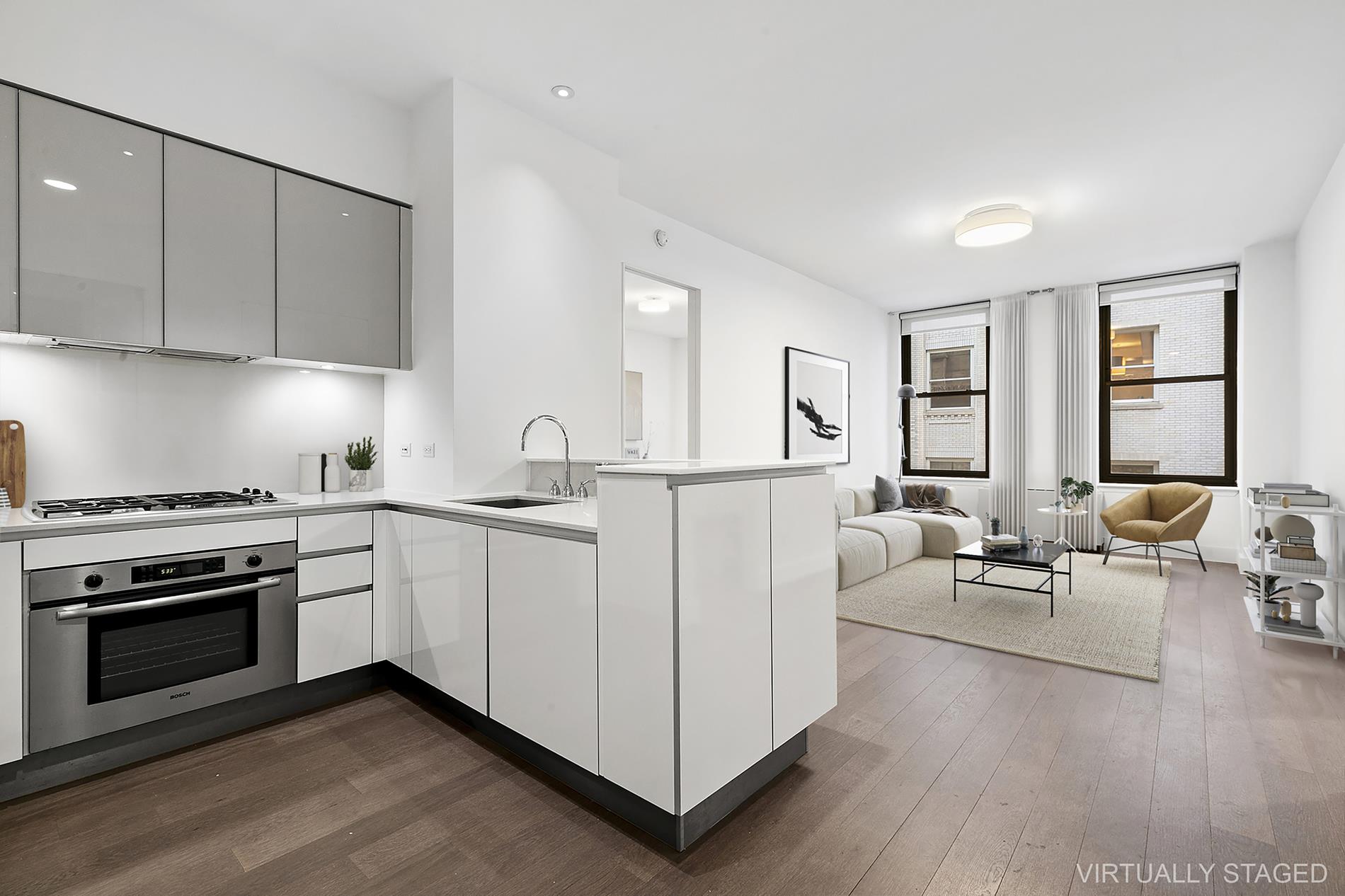 a living room with furniture a stove and a wooden floor