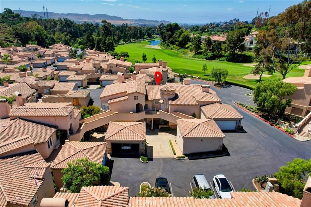 an aerial view of a house with outdoor space patio and lake view